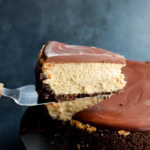 lifting a slice of baileys cheesecake up with a cake slicer