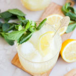 cocktail glasses with bourbon smash cocktails in them