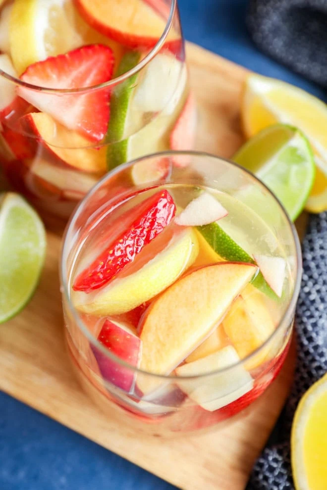 glasses of White sangria with fresh citrus slices on the side