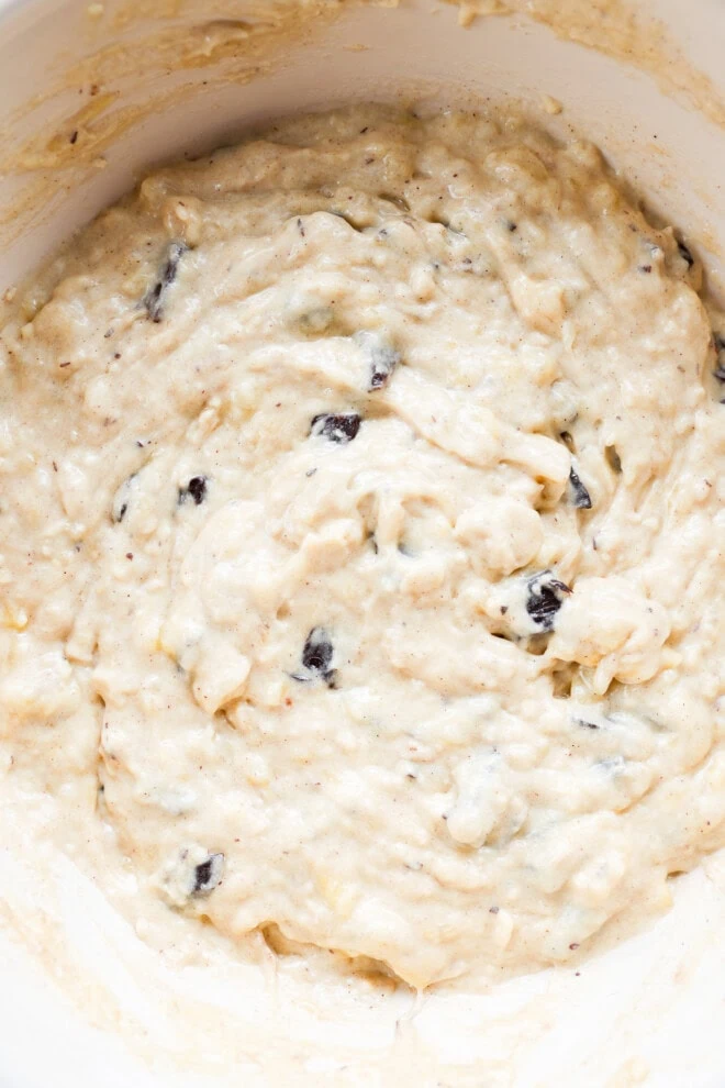 Banana chocolate chunk muffin batter in bowl