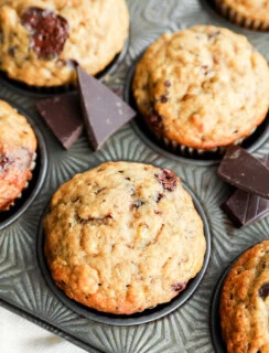 Baked breakfast treats in tin with dark candy and linen