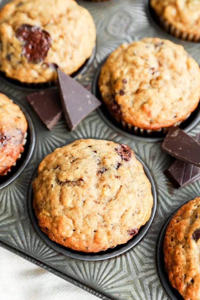 Baked breakfast treats in tin with dark candy and linen