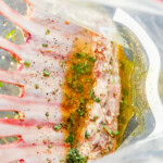 meat in bag with herbs and oil to make it juicy