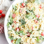 easy mixture of vegetables and penne with dressing in a large bowl