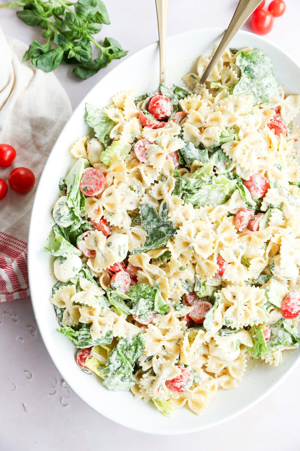 easy mixture of vegetables and penne with dressing in a large bowl