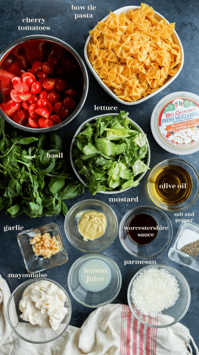 caprese bow tie pasta salad ingredients in bowls with text labels