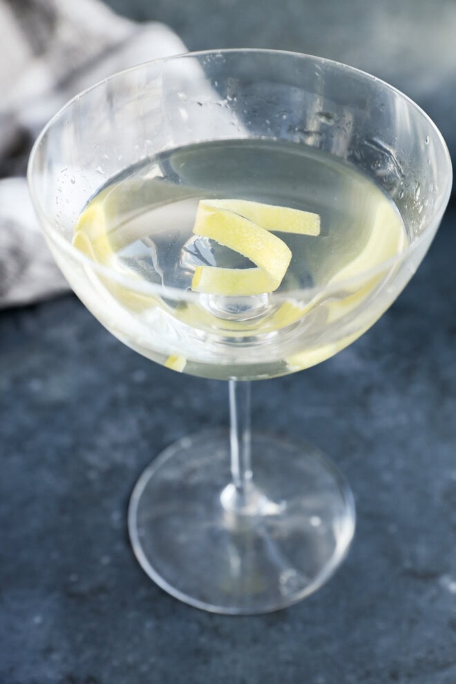 gin martini with a lemon twist garnish in coupe glass