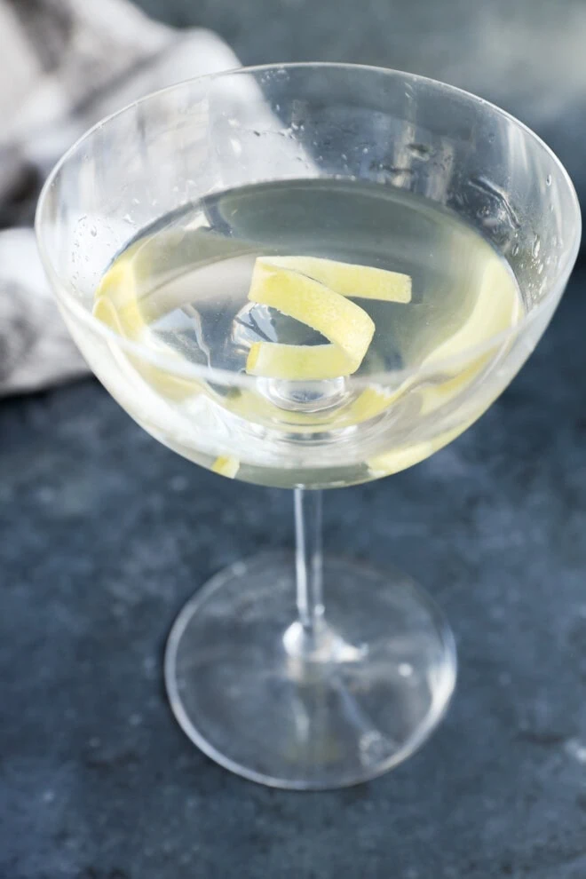 gin martini with a lemon twist garnish in coupe glass