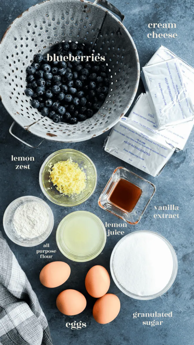 lemon blueberry cheesecake ingredients in bowls with text labels