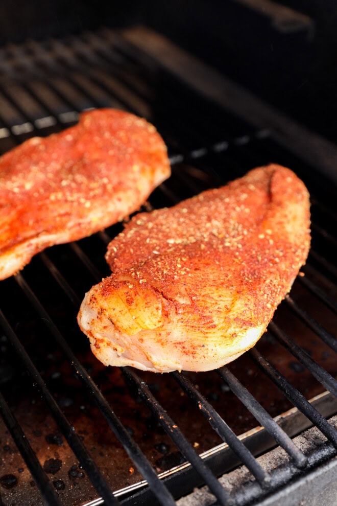 grilling chicken rubbed with spicy smoky seasoning