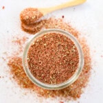 mason jar of seasoning with a spoon to the side