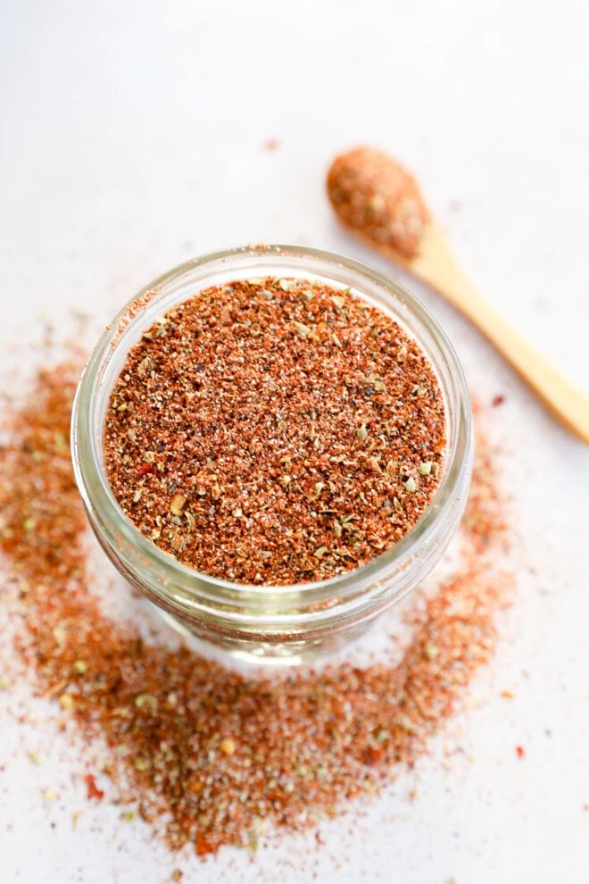 southwest spice mix in a mason jar with a spoon in the background
