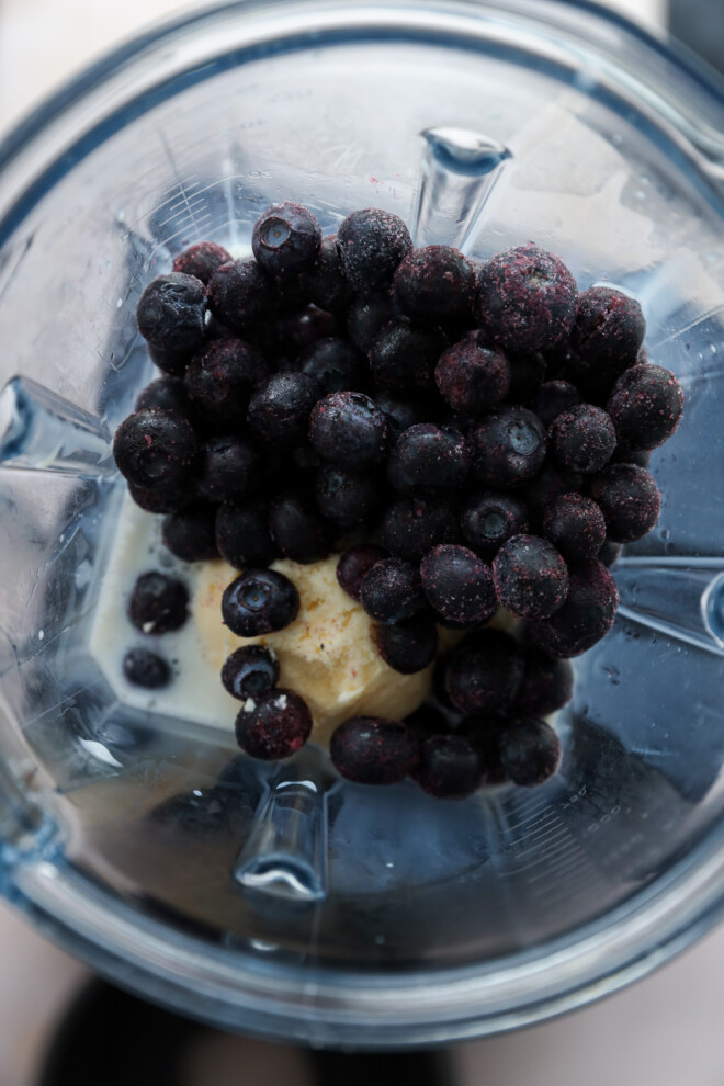 making a blueberry milkshake in a blender