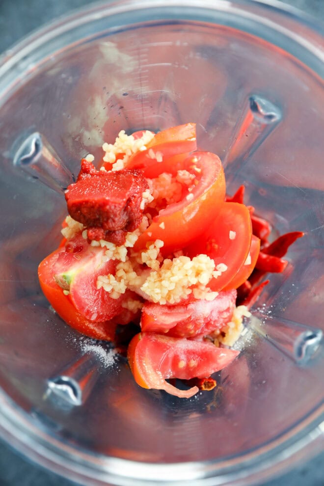 tomatoes, tomato paste, and garlic in a blender