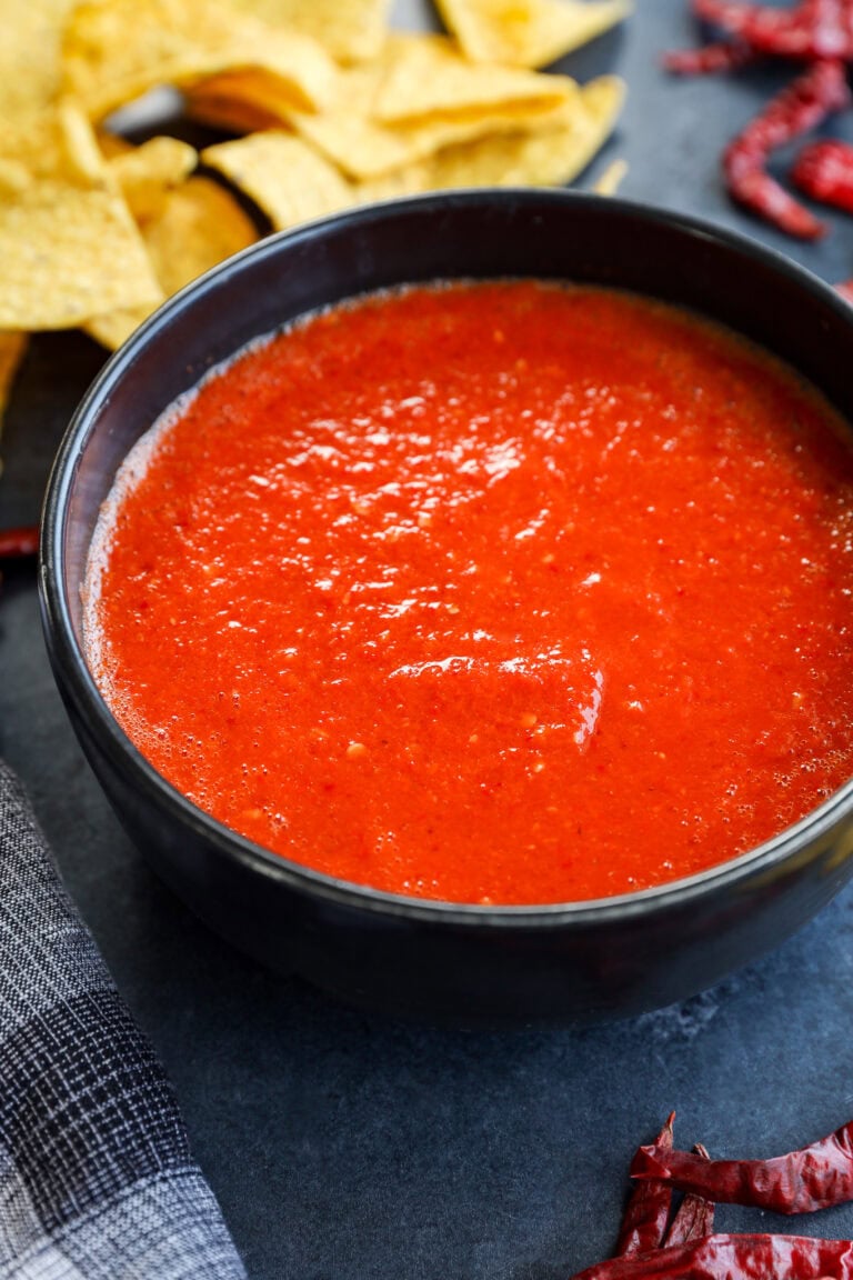 chile de arbol salsa in a bowl with tortilla chips