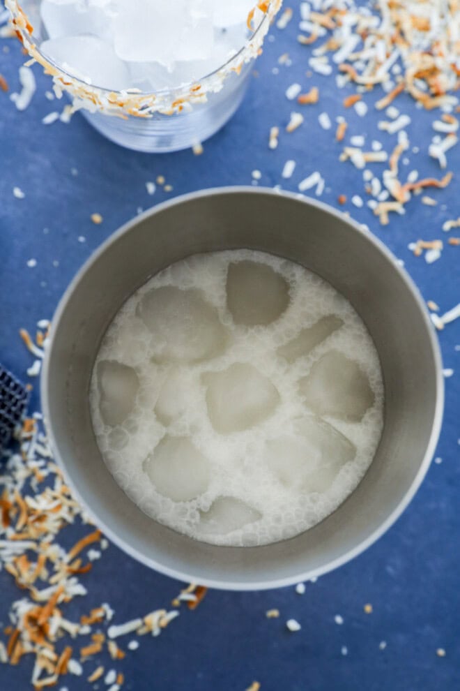 Mixing a Coconut margarita in a cocktail shaker