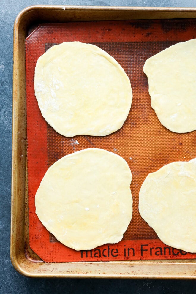 rolled out pastry on baking pan with silicone mat before filling