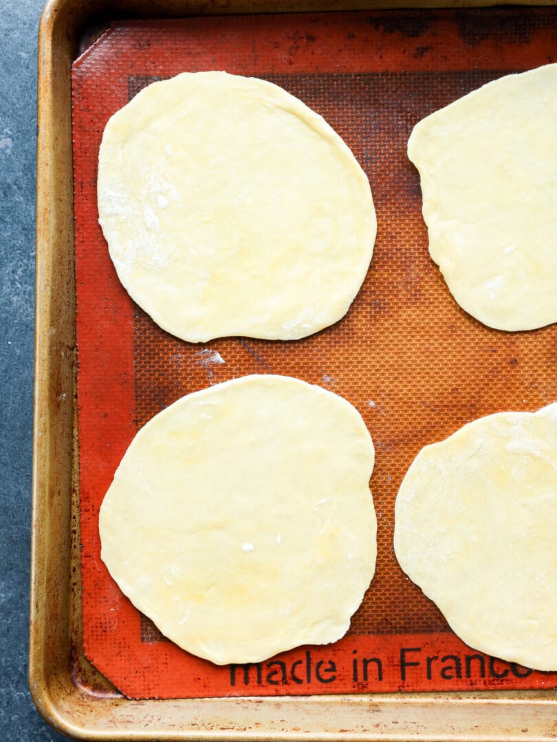 rolled out pastry on baking pan with silicone mat before filling