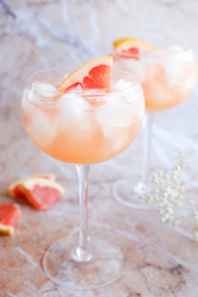 grapefruit vodka elderflower liqueur cocktail in stemmed wine glasses