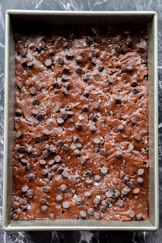 chocolate chocolate chip cookie bars in baking pan before baking