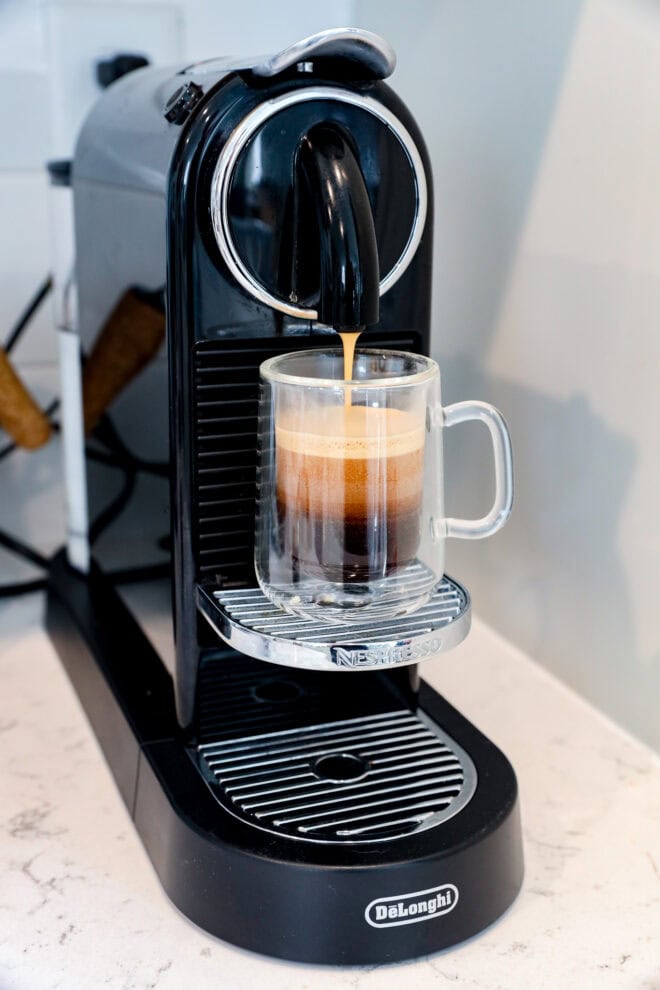 making espresso with an espresso machine in small glass