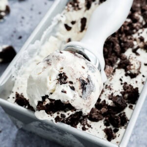 Scoop of cookies and cream frozen dessert in scoop