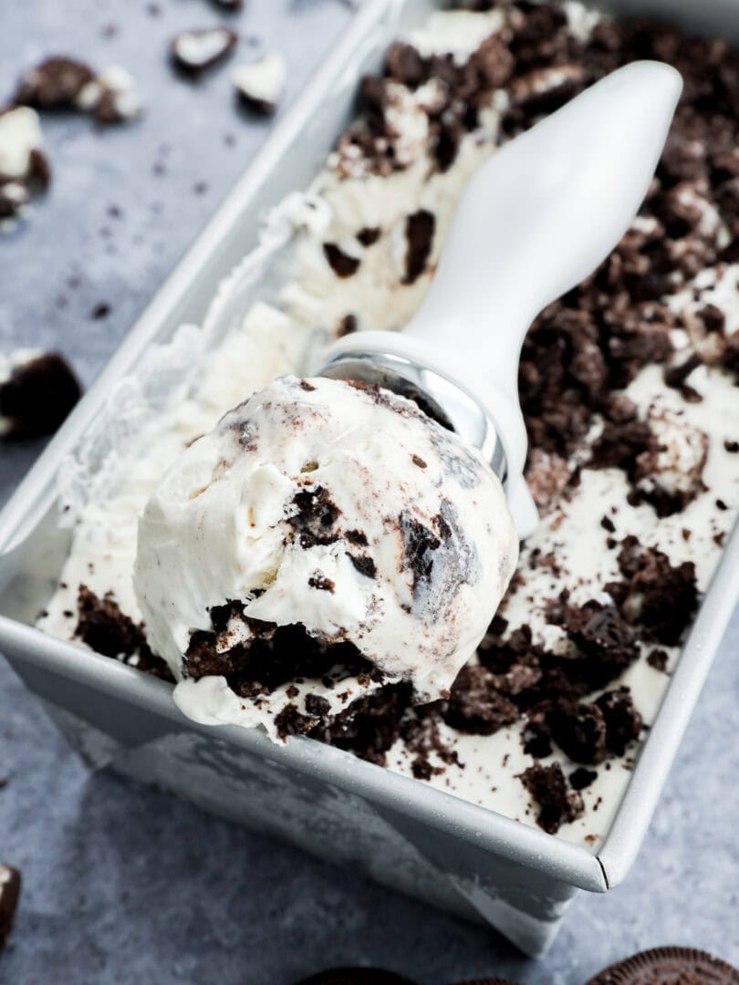 Scoop of cookies and cream frozen dessert in scoop