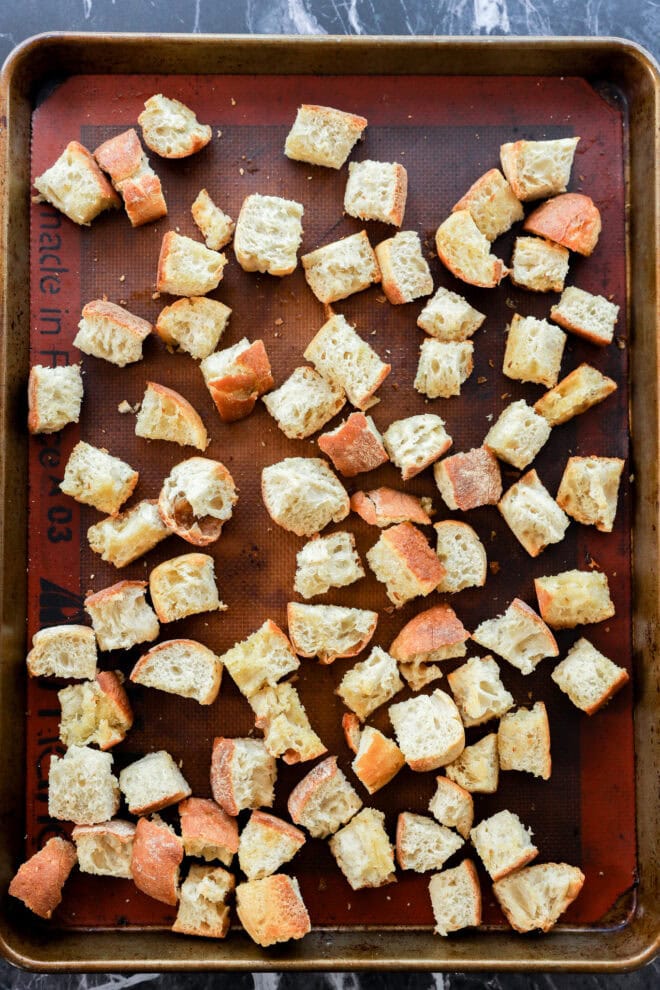 toasted bread cubes on baking sheet