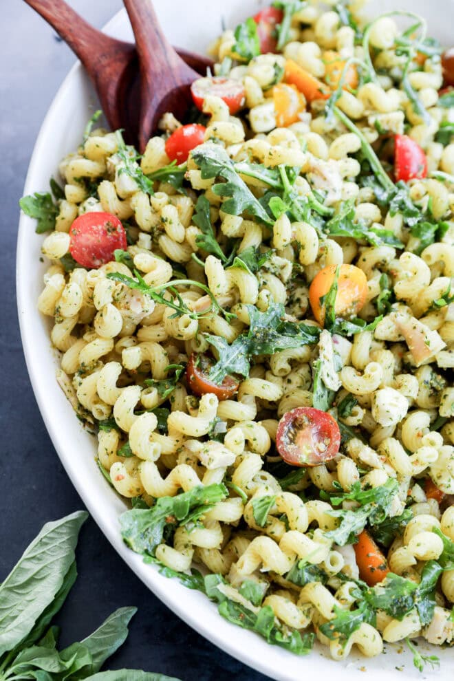 Easy light lunch or dinner made with poultry and cavatappi in a large white bowl with fresh basil