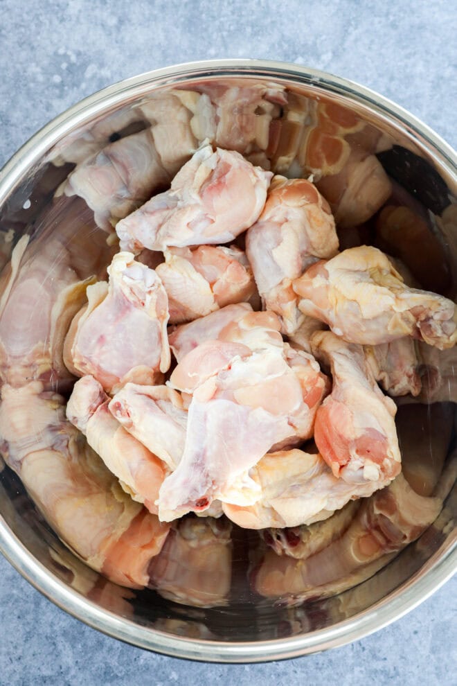 raw chicken wings in large metal bwol
