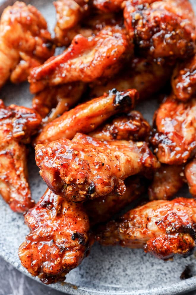 plate of smoked chicken wings tossed with bbq sauce