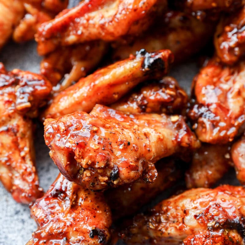 plate of smoked chicken wings tossed with bbq sauce