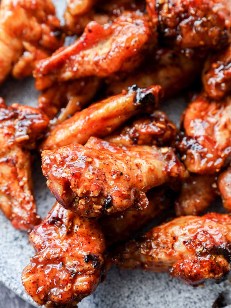 plate of smoked chicken wings tossed with bbq sauce