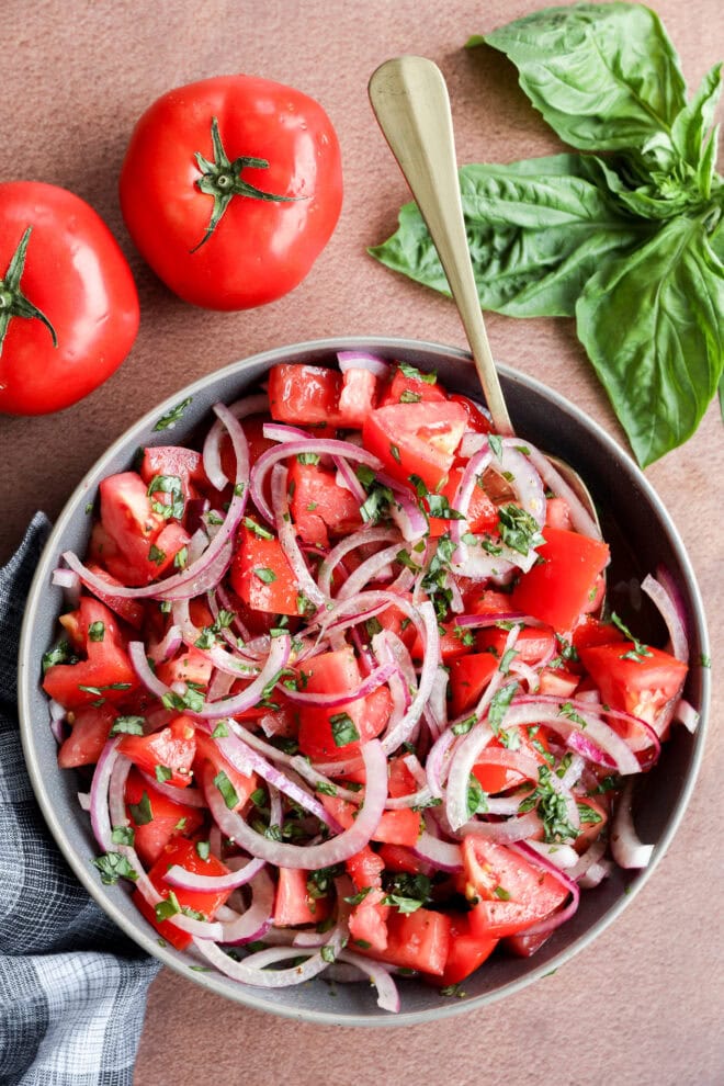 fresh summery vegetarian side dish with bowls and fresh basil
