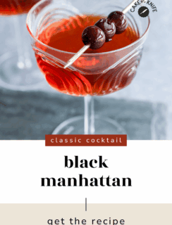 A close-up of a Black Manhattan cocktail in a glass, garnished with two dark cherries on a pick. Text reads classic cocktail, Black Manhattan, get the recipe. The image is from Cake n Knife.