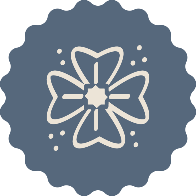 A stylized cream-colored flower with four petals and small dots surrounds it, centered on a scalloped dark blue circular background.