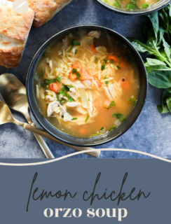 A bowl of lemon and chicken soup with orzo, vegetables, and herbs sits next to crusty bread, basil leaves, and two gold spoons on a blue surface, with the text lemon chicken orzo soup at the bottom.