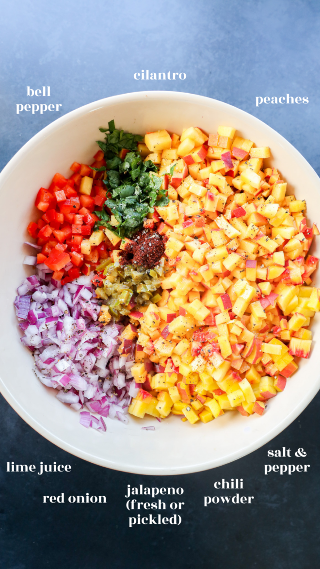 A bowl contains diced peaches, red bell pepper, red onion, jalape&ntilde;o, chopped cilantro, chili powder, salt, pepper, and lime juice. Each ingredient is grouped separately and labeled with white text.